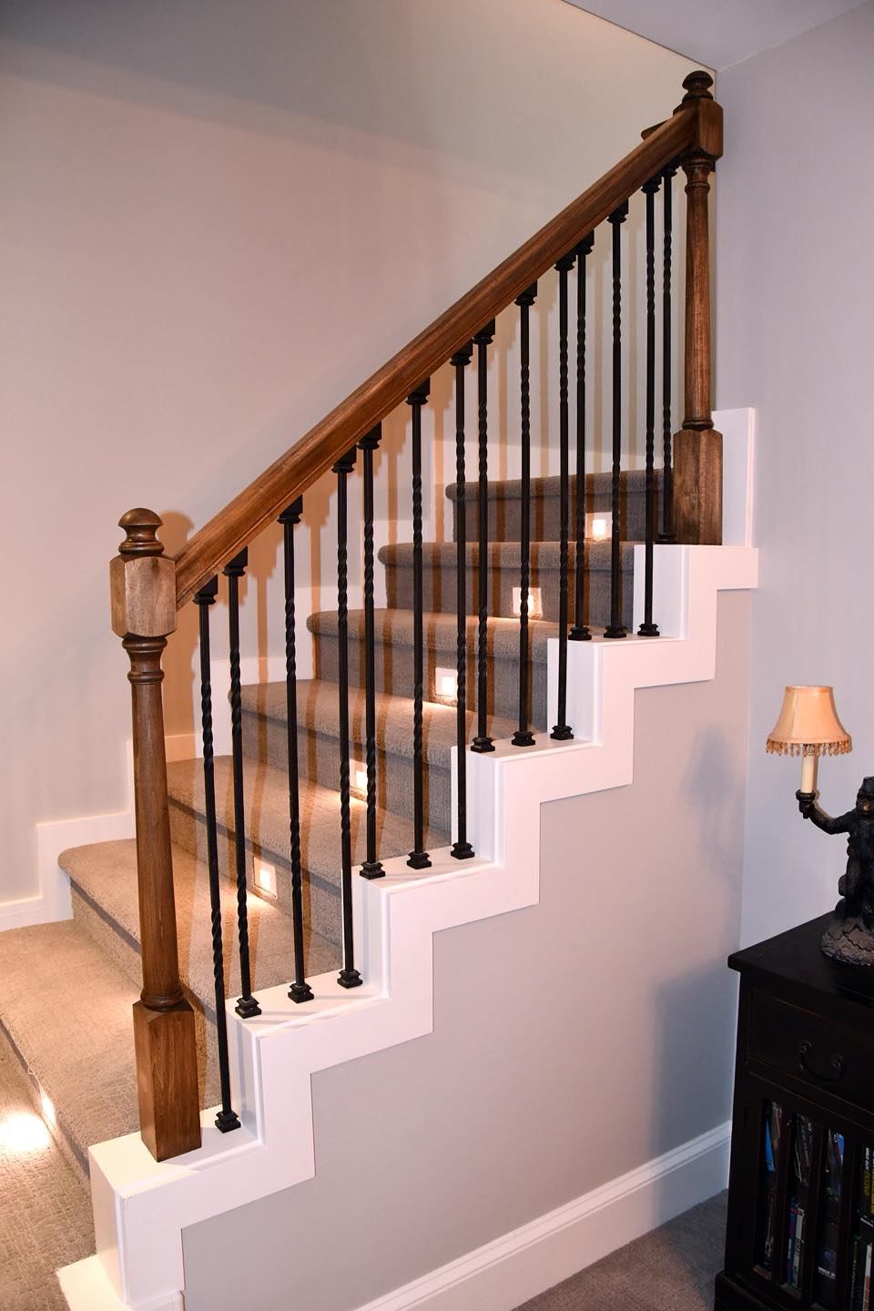 Bunz and Sonz Construction craftsmanship - custom staircase with iron balusters