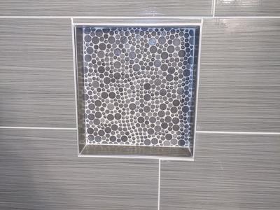 Shower niche with bubble mosaic tile