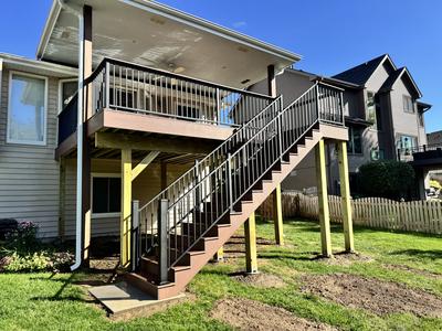 Elevated composite deck with covered porch roof