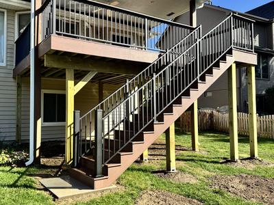 Composite deck staircase from yard angle