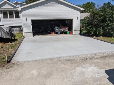 Freshly poured concrete driveway broom finish