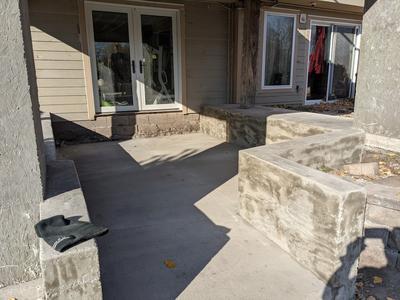 Multi-level concrete patio with custom steps