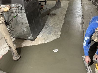 Concrete floor being hand-troweled