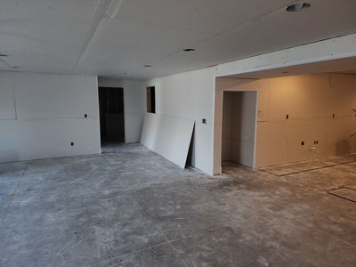 Finished drywall in basement — clean and ready to paint