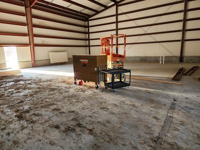 Large commercial space with scissor lift — scale work