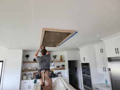 Nick at work installing a ceiling medallion