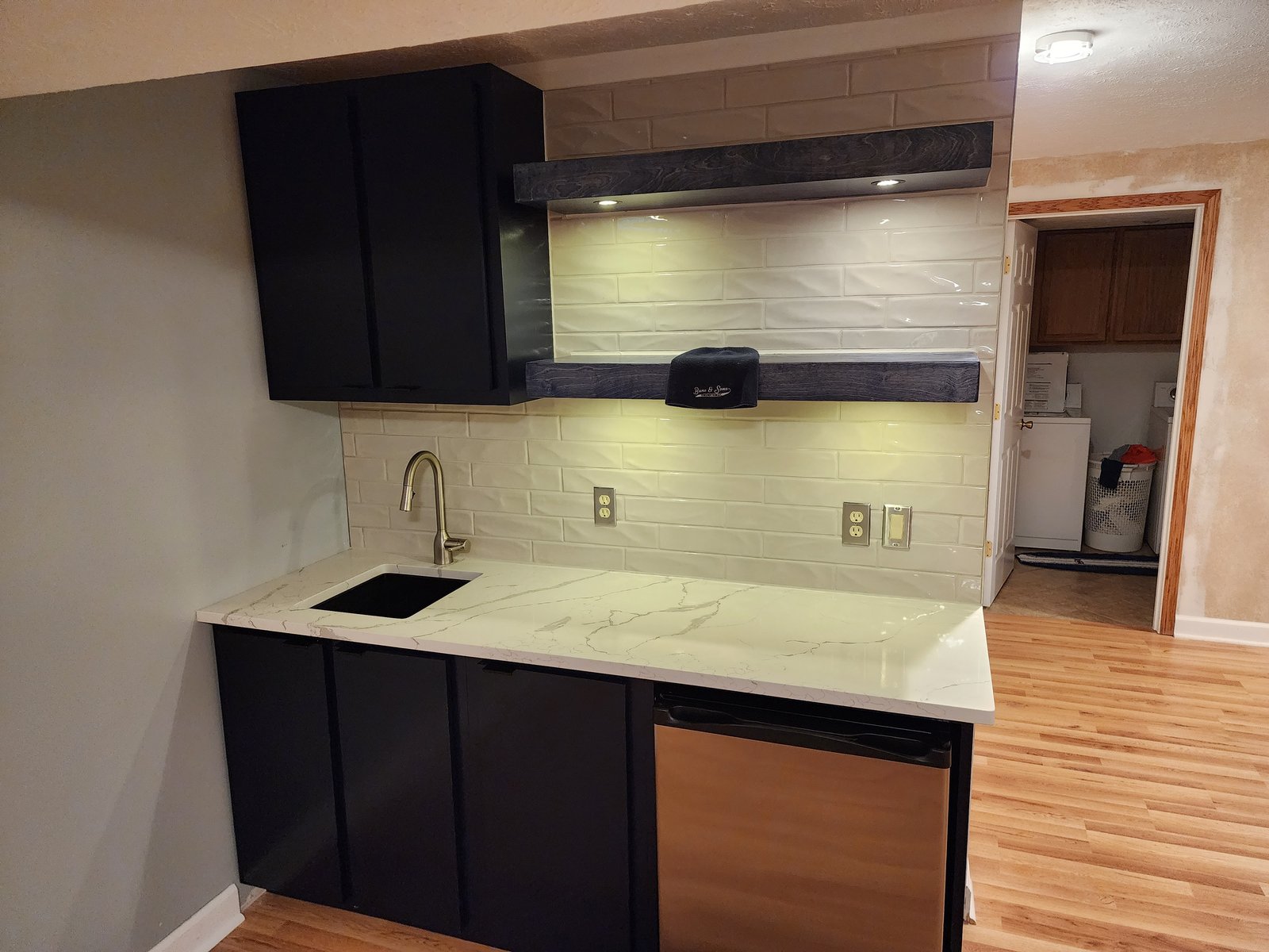 Finished basement wet bar by Bunz and Sonz Construction