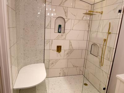 Luxury walk-in shower with gold fixtures