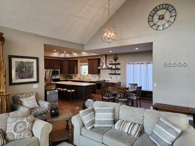 Open-concept living and kitchen with vaulted ceiling