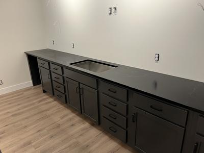 Custom black shaker base cabinet run