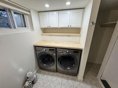 Laundry room with custom cabinets and butcher block