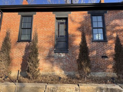 Historic brick building exterior with newly restored windows